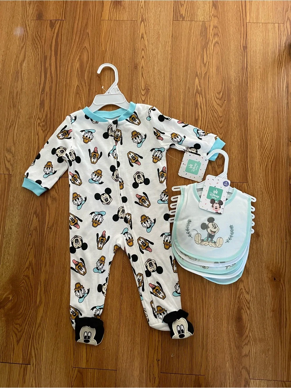 Disney baby footed sleeper and matching bibs